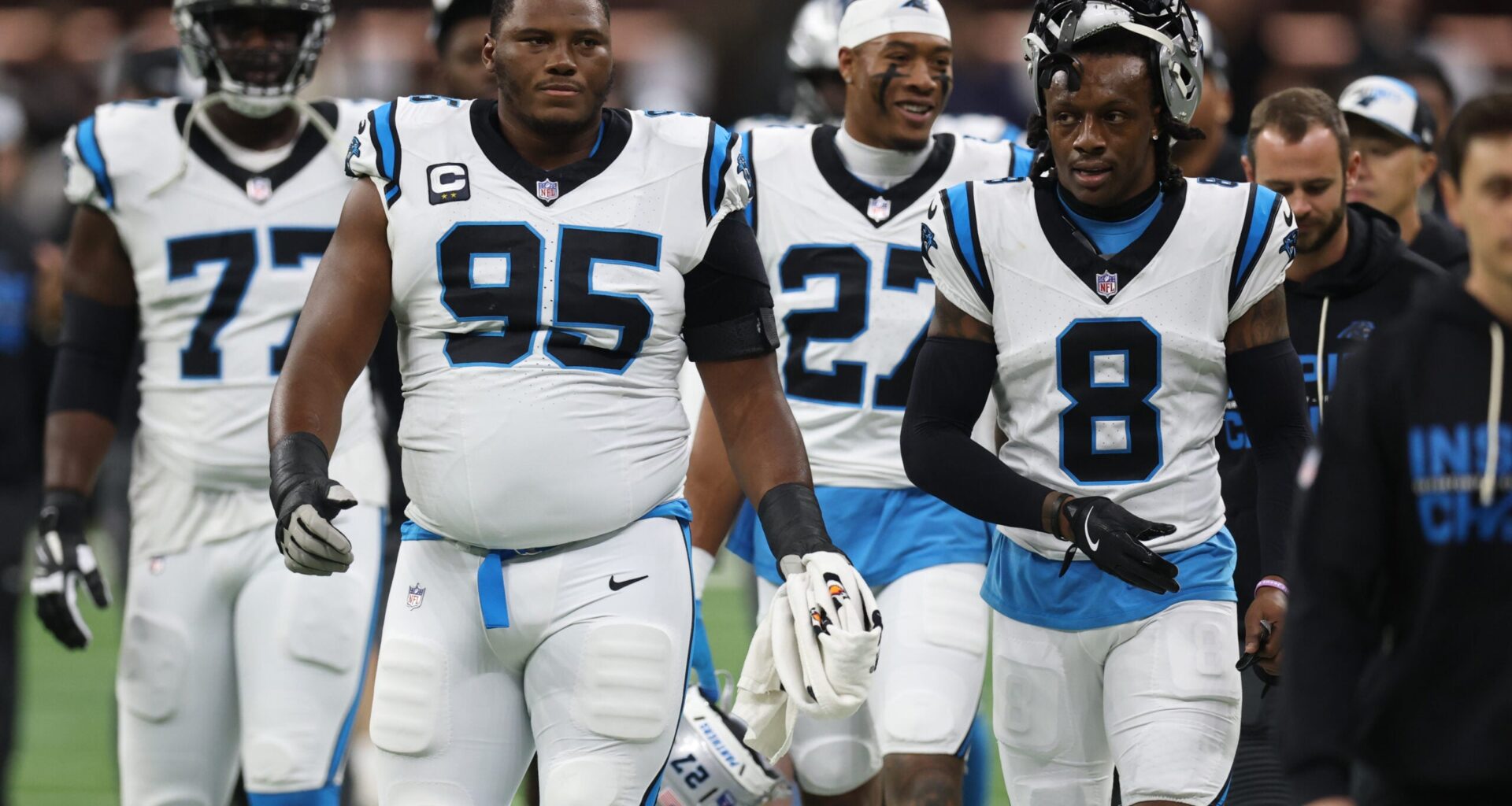 Dec 14, 2025; New Orleans, Louisiana, USA; Carolina Panthers defensive end Derrick Brown (95) and cornerback Jaycee Horn (8) walk on the field before the game against the New Orleans Saints at Caesars Superdome.