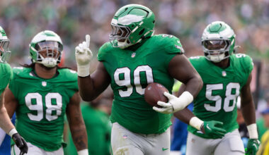 Philadelphia Eagles defensive tackle Jordan Davis (90) celebrate with teammates after his fumble recovery against the Dallas Cowboys during the second quarter at Lincoln Financial Field.