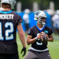 Jun 9, 2026; Charlotte, NC, USA; Carolina Panthers quarterback Will Grier (14) and quarterback Kenny Pickett (12) watch quarterback Bryce Young (9) during the first day of mini camp at Bank of America Stadium practice facility.