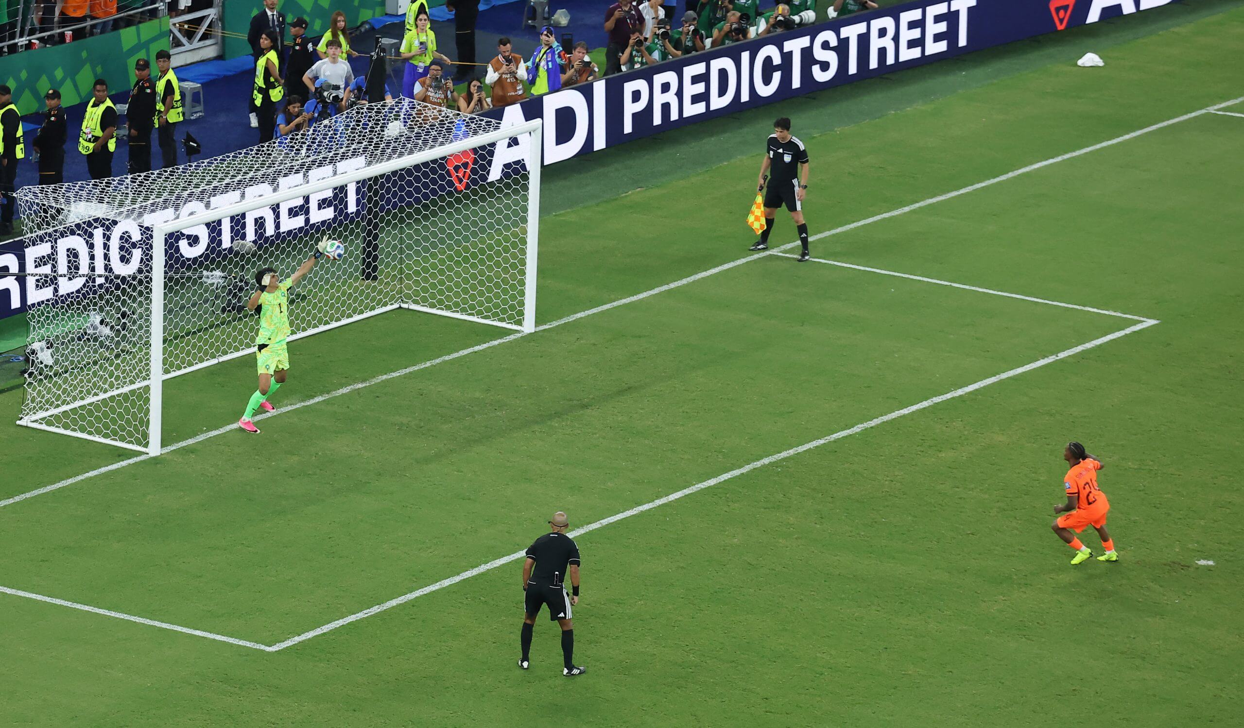 Yassine Bounou holds out his left arm to save Crysencio Summervilles penalty