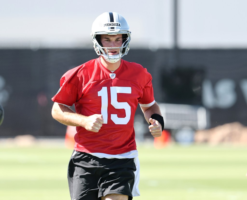 Mendoza in a red jersey with number 15 and a white helmet.