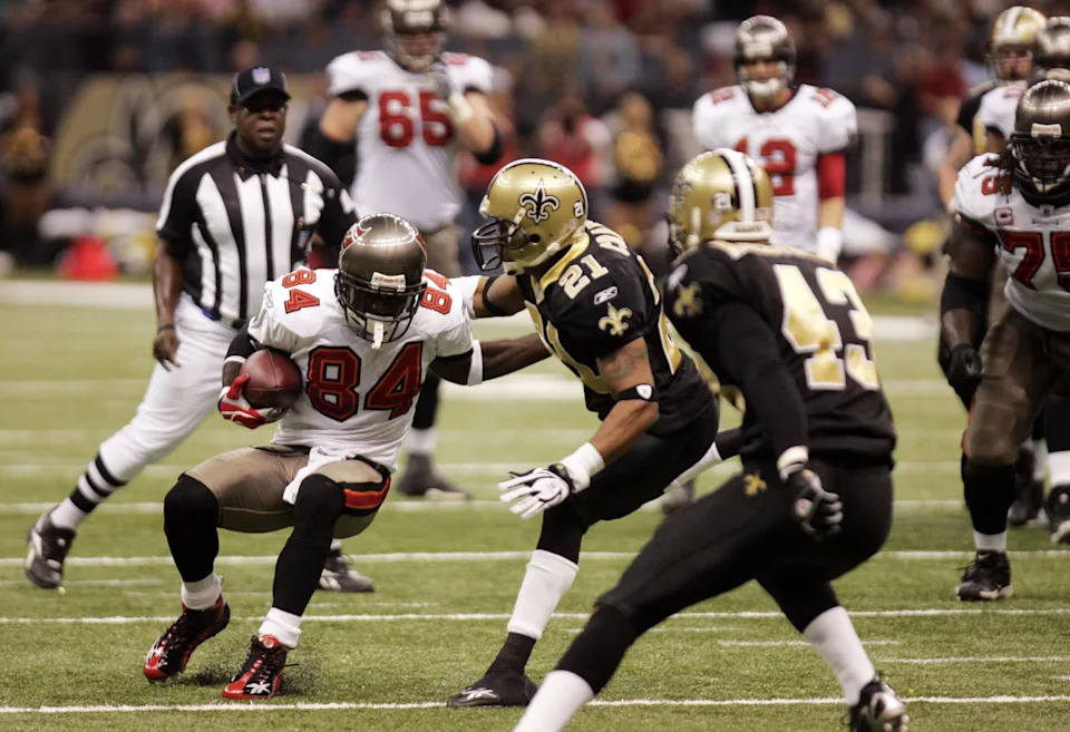 Dec. 2, 2007; New Orleans, LA, USA; Tampa Bay Buccaneers wide receiver (84) Joey Galloway tries to avoid the tackle of New Orleans Saints corner back (21) Jason Craft during the first half at the Louisiana Superdome. Mandatory Credit: Matt Stamey-USA TODAY Sports Copyright © 2007 Matt Stamey