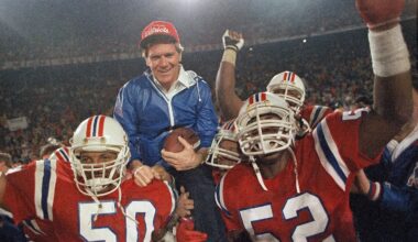 FILE - IN this Jan. 12, 1986, file photo, New England Patriots coach Raymond Berry gets a victory ride from players Larry McGrew (50) and Johnny Rembert (52) after the Patriots defeated the Miami Dolphins 31-14 in the NFL football AFC playoffs in Miami.