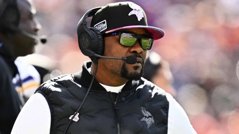 Vikings defensive coordinator Brian Flores watches from the sideline during a game against the Chicago Bears. Vikings offseason