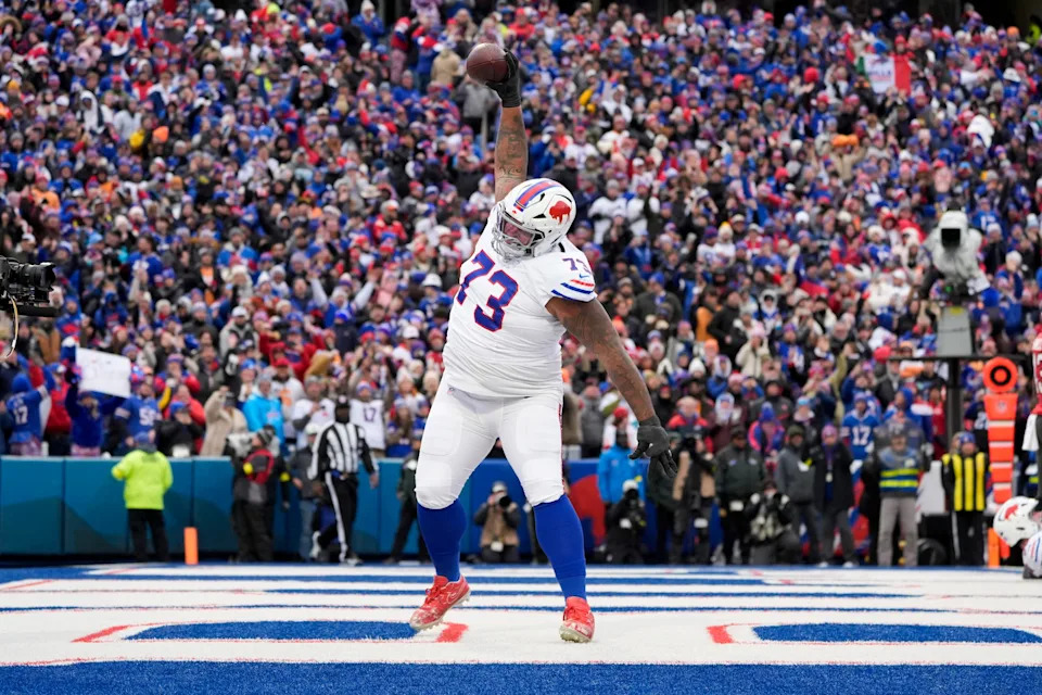 Nov 16, 2025; Orchard Park, New York, USA; Buffalo Bills offensive tackle Dion Dawkins (73) celebrates Josh Allen’s first quarter touchdown against the Tampa Bay Buccaneers at Highmark Stadium.