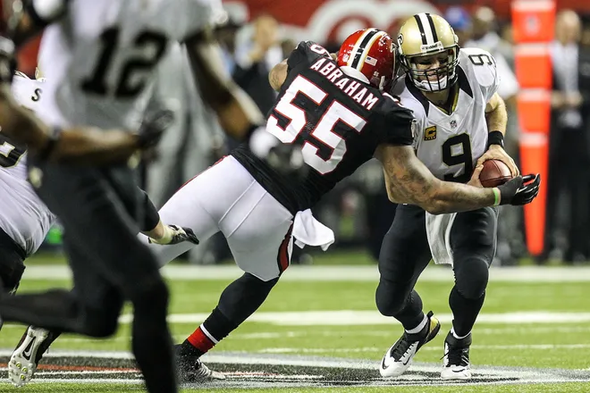 Nov 29, 2012; Atlanta, GA, USA; New Orleans Saints quarterback Drew Brees (9) is sacked by Atlanta Falcons defensive end John Abraham (55) in the second half at the Georgia Dome. The Falcons won 23-13. Mandatory Credit: Daniel Shirey-USA TODAY Sports