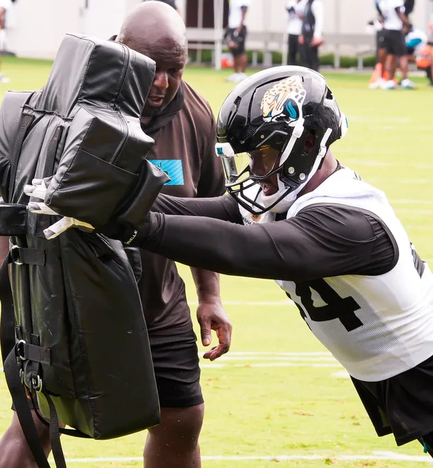 Jaguars defensive end Travon Walker (44) explodes into a sled during the Jaguarsâ€™ fourth OTA of the year, Monday June 1, 2026 at the Miller Electric Center in Jacksonville, Fla. [Doug Engle/Florida Times-Union]
