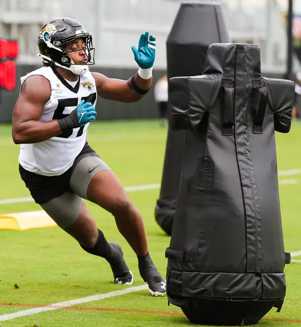 Jaguars defensive end Bryan Thomas Jr. (57) runs a drill with center Robert Hainsey (73) during the Jaguarsâ€™ fourth OTA of the year, Monday June 1, 2026 at the Miller Electric Center in Jacksonville, Fla. [Doug Engle/Florida Times-Union]