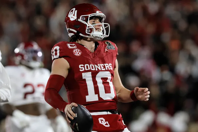 NORMAN, OKLAHOMA - DECEMBER 19: John Mateer #10 of the Oklahoma Sooners runs the ball for touchdown during the first quarter against the Alabama Crimson Tide during 2025 College Football Playoff First Round Game at Gaylord Family Oklahoma Memorial Stadium on December 19, 2025 in Norman, Oklahoma. (Photo by Brian Bahr/Getty Images)