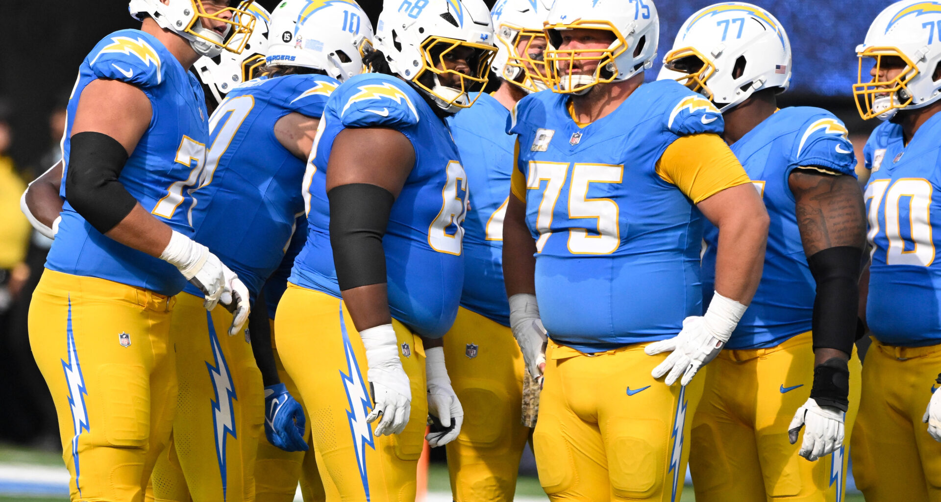 Los Angeles Chargers offensive tackle Joe Alt (76), quarterback Justin Herbert (10), guard Jamaree Salyer (68), fullback Scott Matlock (44), center Bradley Bozeman (75), guard Zion Johnson (77), and offensive tackle Rashawn Slater (70) during and NFL game against the Tennessee Titans at SoFi Stadium.