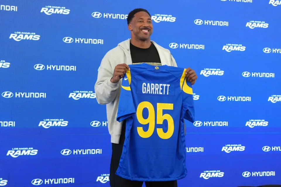 Los Angeles Rams defensive end Myles Garrett (95) poses with jersey at press conference at Rams Practice Facility.
