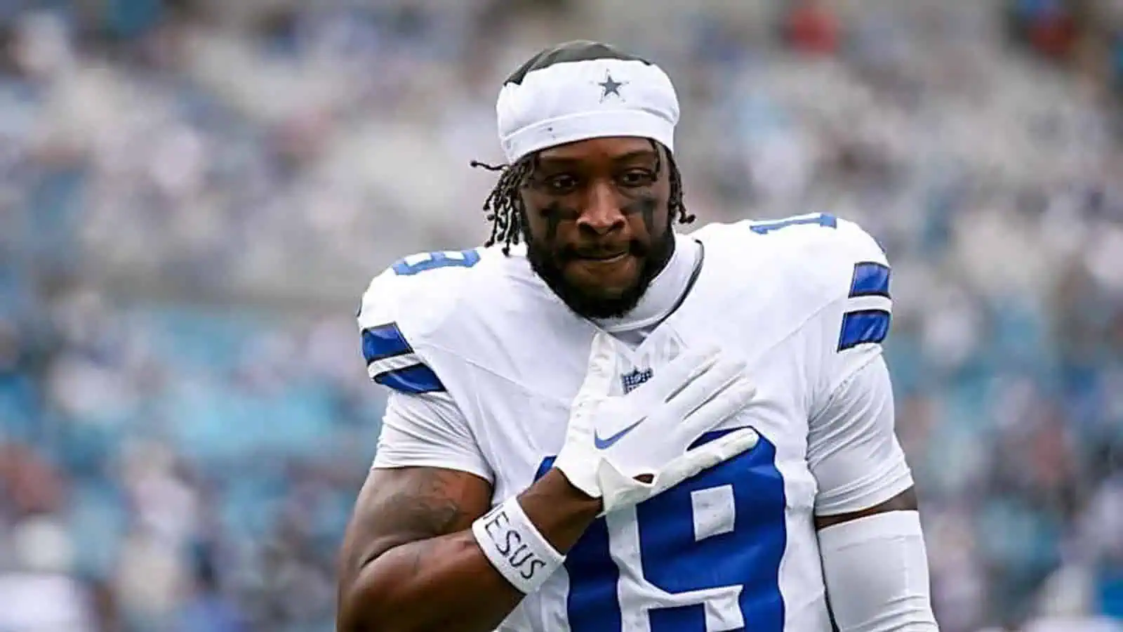 Close-up of Ryan Flournoy in Dallas Cowboys uniform wearing a white headband before kickoff