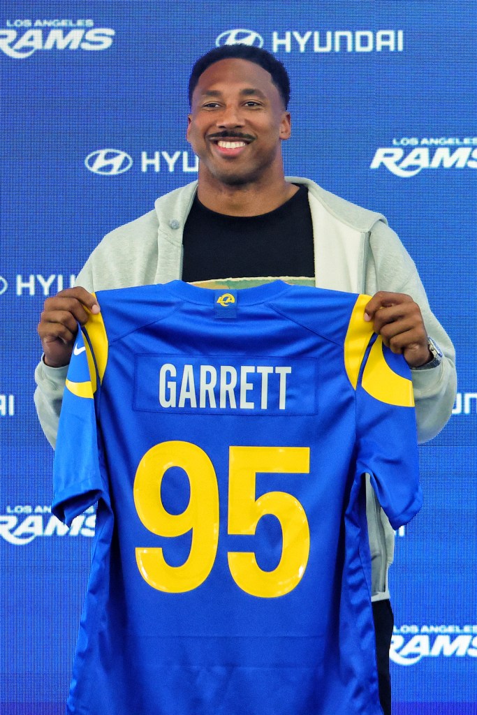 Myles Garrett of the Los Angeles Rams poses with his jersey during a press conference after an organized team activities workout at Rams Village at the Warner Center on June 2, 2026 in Woodland Hills, California.