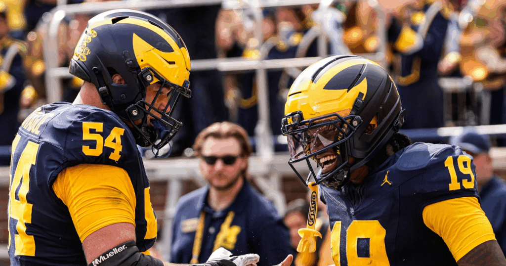 Michigan Wolverines football offensive lineman Andrew Sprague and quarterback Bryce Underwood celebrate after a touchdown in a 63-3 win over Central Michigan. (Photo by Junfu Han / USA TODAY NETWORK via Imagn Images)
