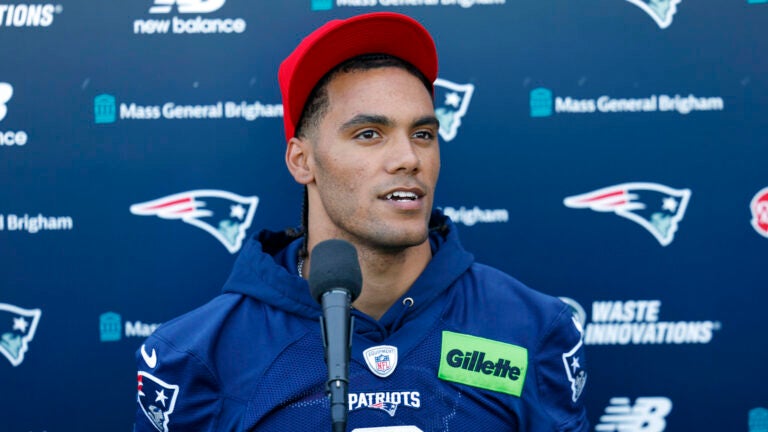 New England Patriots cornerback Christian Gonzalez (0) talks to reporters after practice at Gillette Stadium on June 9, 2026 in Foxborough.