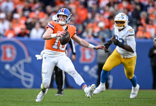 Bo Nix (10) of the Denver Broncos scrambles for a gain against the Los Angeles Chargers during the third quarter at Empower Field at Mile High in Denver on Sunday, January 4, 2026. (Photo by AAron Ontiveroz/The Denver Post)
