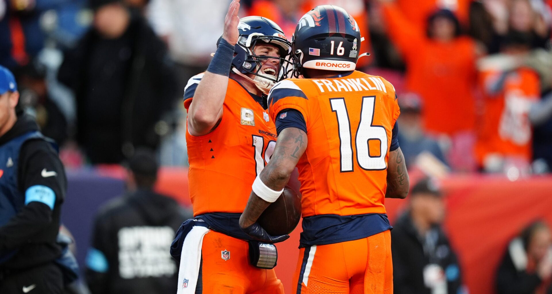 Nov 17, 2024; Denver, Colorado, USA; Denver Broncos wide receiver Troy Franklin (16) celebrates his touchdown with quarterback Bo Nix (10) in the second half against the Atlanta Falcons at Empower Field at Mile High.