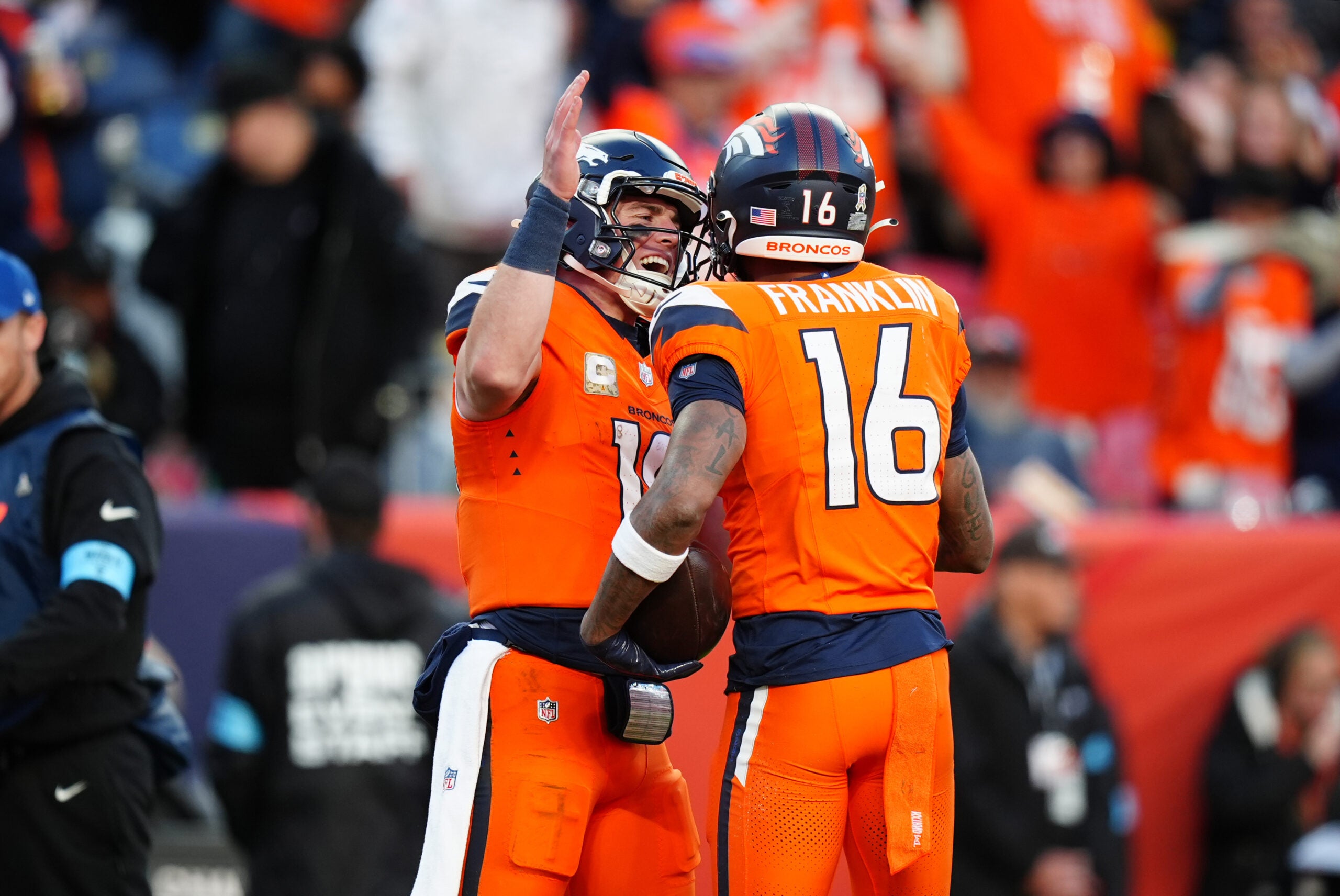 Nov 17, 2024; Denver, Colorado, USA; Denver Broncos wide receiver Troy Franklin (16) celebrates his touchdown with quarterback Bo Nix (10) in the second half against the Atlanta Falcons at Empower Field at Mile High.