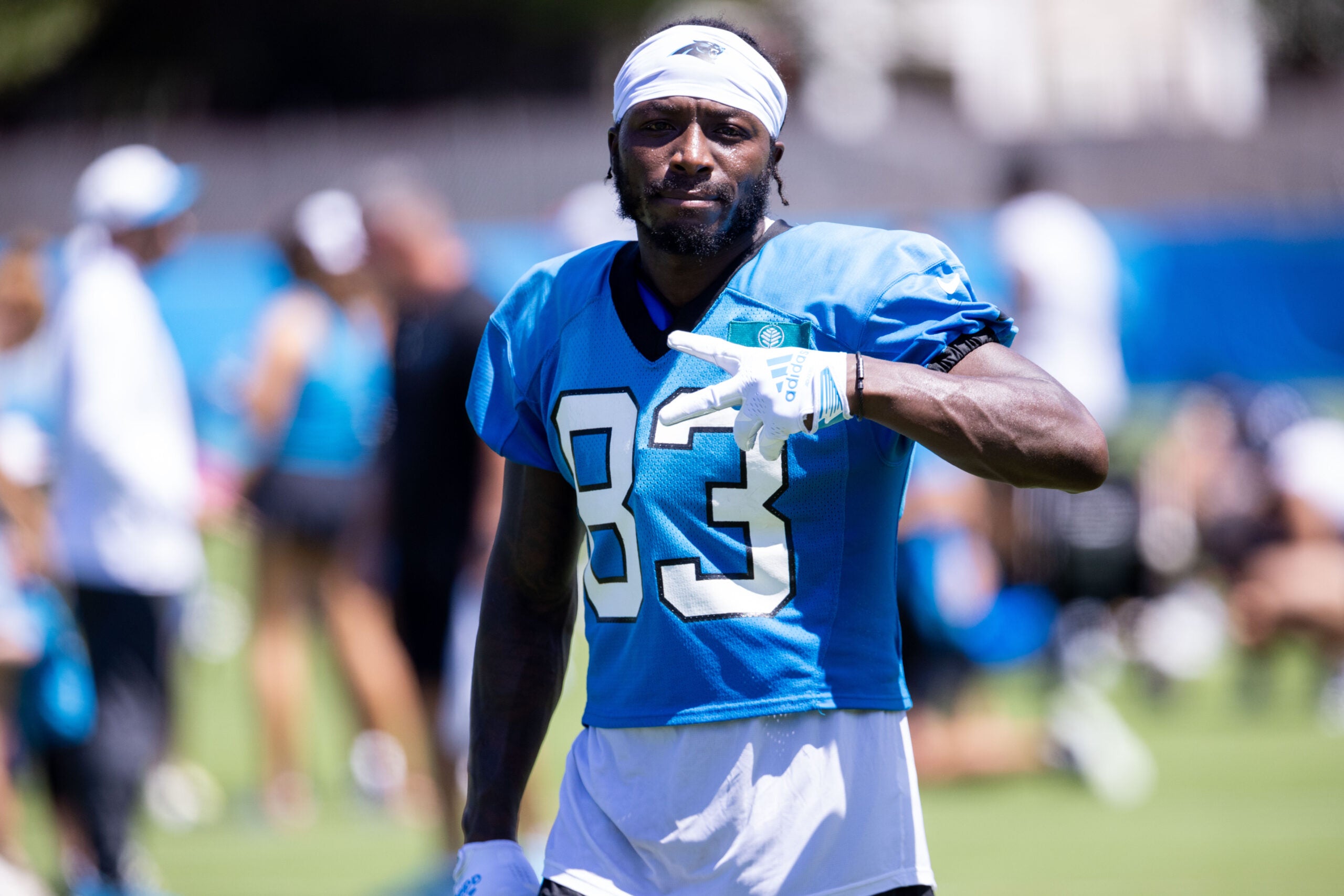 Jul 26, 2025; Charlotte, NC, USA; Carolina Panthers wide receiver David Moore (83) mugs for the camera as he walks off after practice during training camp.