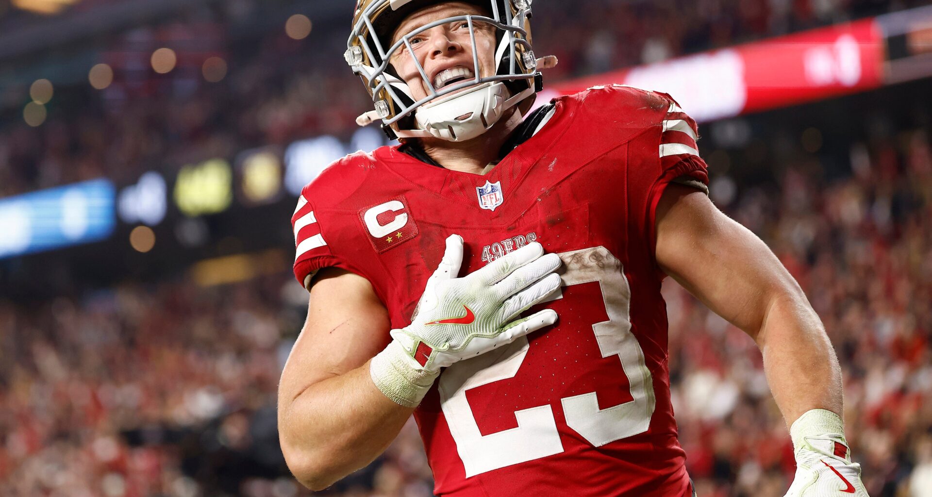 Nov 24, 2025; Santa Clara, California, USA; San Francisco 49ers running back Christian McCaffrey (23) reacts after scoring a touchdown against the Carolina Panthers during the second half at Levi