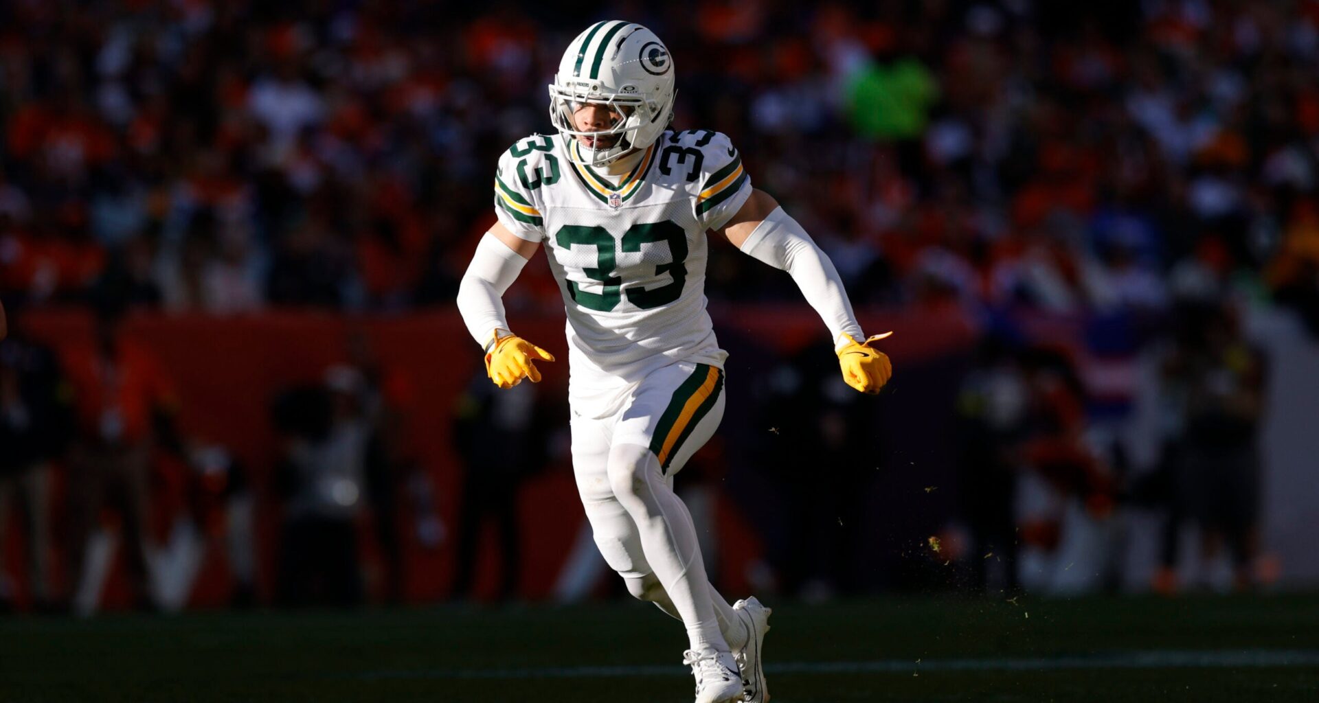 Dec 14, 2025; Denver, Colorado, USA; Green Bay Packers safety Evan Williams (33) runs downfield during the second quarter against the Denver Broncos at Empower Field at Mile High.