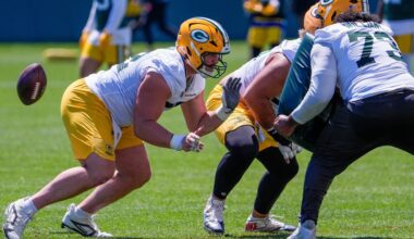 Green Bay Packers offensive lineman Jager Burton (52) runs through a drill during practice on Tuesday, June 2, 2026, at Ray Nitschke Field in Ashwaubenon, Wis.