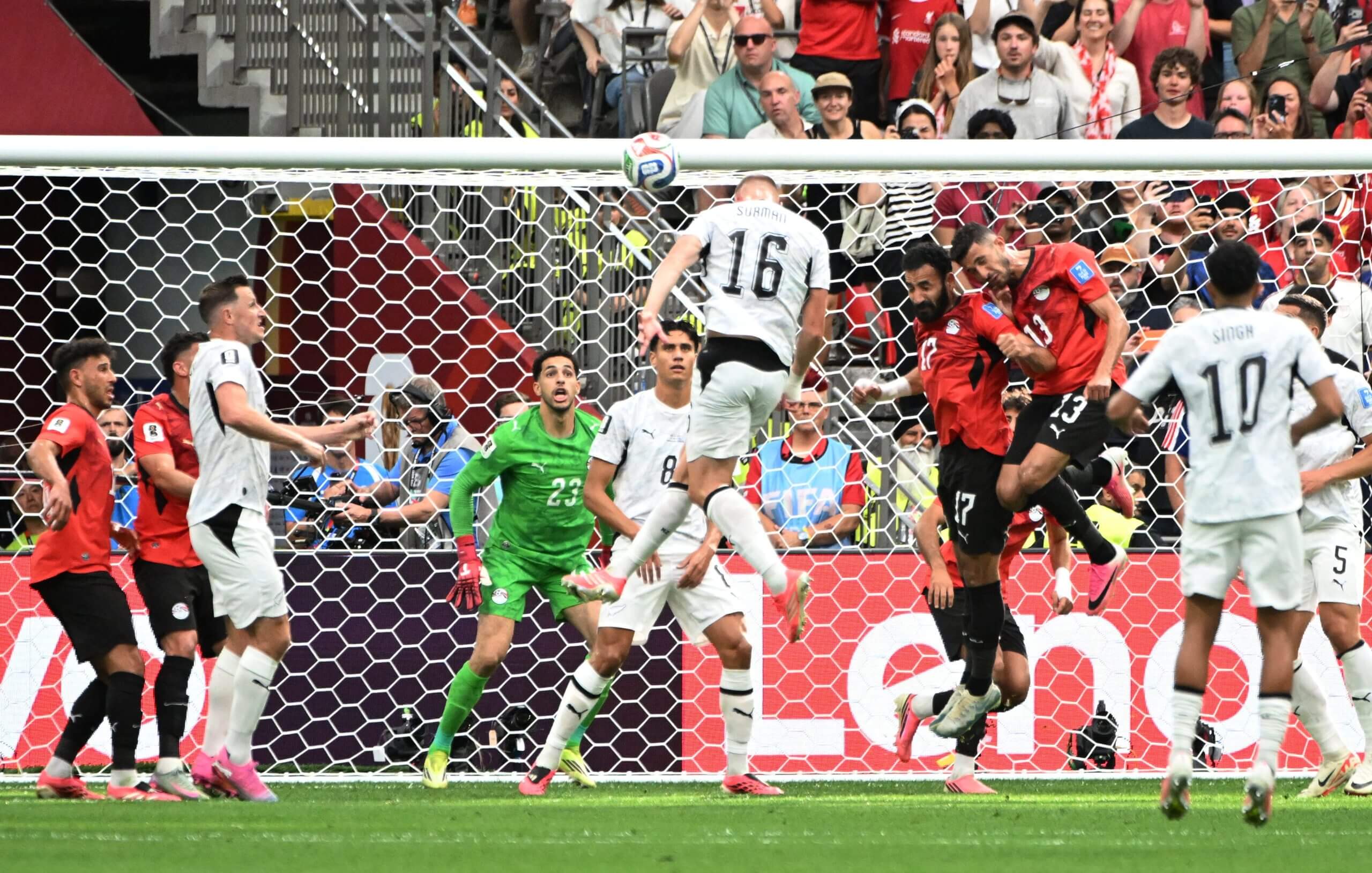 Finn Surman leaps high to score a goal for New Zealand vs. Egypt