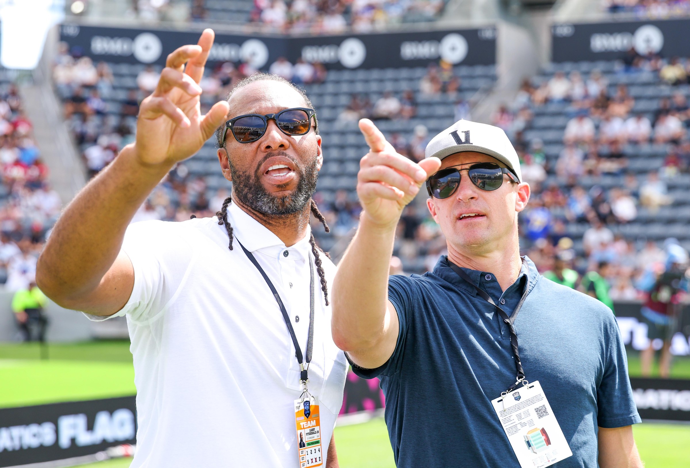 Fellow HOF inductees Larry Fitzgerald and Drew Brees attend the Fanatics Flag Football Classic (Photo by Kevin C. Cox/Getty Images for OBB Media - FANATICS STUDIOS)