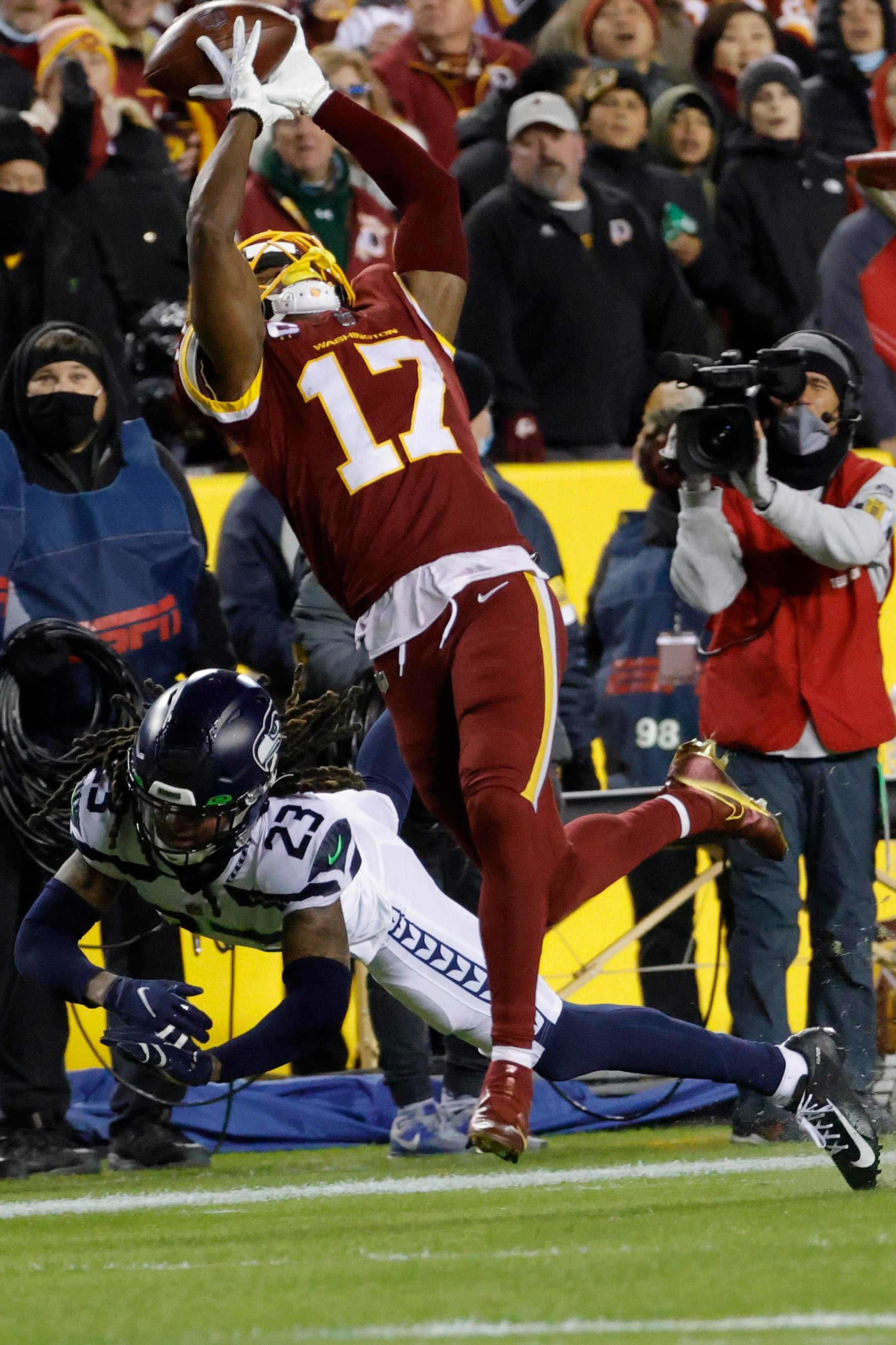 Nov 29, 2021; Landover, Maryland, USA; Washington Football Team wide receiver Terry McLaurin (17) attempts to catch a pass as Seattle Seahawks cornerback Sidney Jones IV (23) defends during the second quarter at FedExField. Mandatory Credit: Geoff Burke-Imagn Images