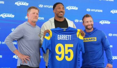 Los Angeles Rams defensive end Myles Garrett (95) poses with general manager Les Snead (left) and coach Sean McVay at press conference at Rams Practice Facility. Mandatory Credit: Kirby Lee-Imagn Images