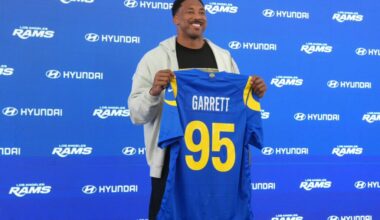 Los Angeles Rams defensive end Myles Garrett (95) poses with jersey at press conference at Rams Practice Facility.
