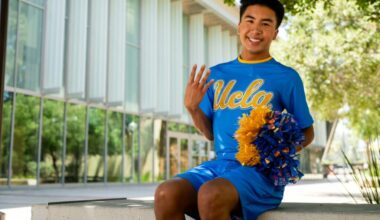 UCLA Dance Team member Ryan Bucu sits and holds up four fingers. The second male member of the team has amassed more than 22,000 followers on Instagram and 18,000 followers on TikTok.