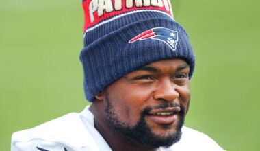 Patriots Keyshon Boutte wears a winter hat during stretching exercises as the New England Patriots held training camp at their facility at Gillette Stadium on Thursday.