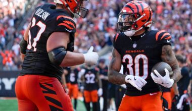 Cincinnati Bengals halfback Chase Brown (30) and guard Cordell Volson (67) celebrate Brown’s touchdown in the 4th quarter Sunday October 6, 2024 at Payor Stadium. The Bengals lost to Baltimore Ravens 41-38 in overtime.
