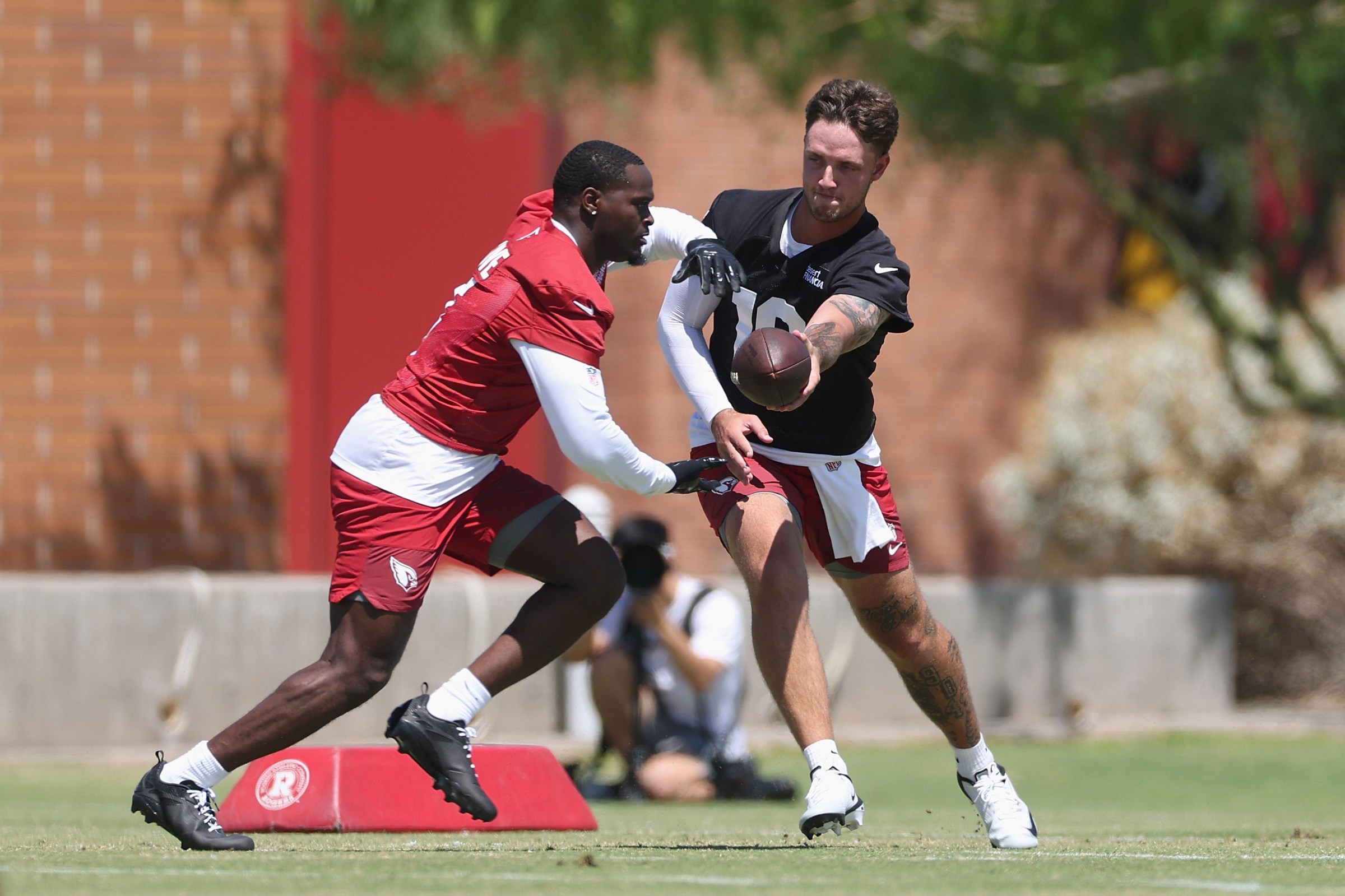 Rookie QB Carson Beck #19 hands off rookie RB Jeremiyah Love #4 (Photo by Christian Petersen/Getty Images)
