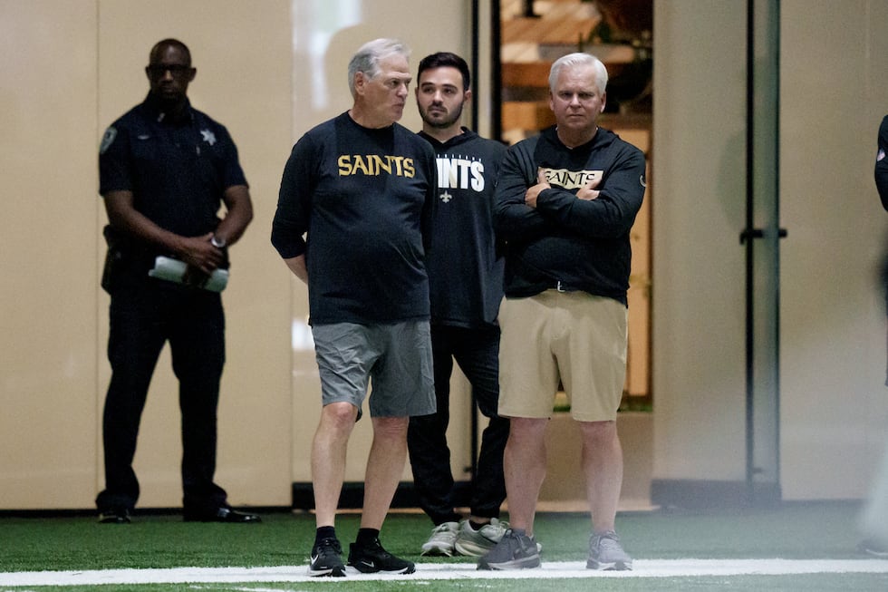 FILE - New Orleans Saints executive vice president/general manager Mickey Loomis, second left,...