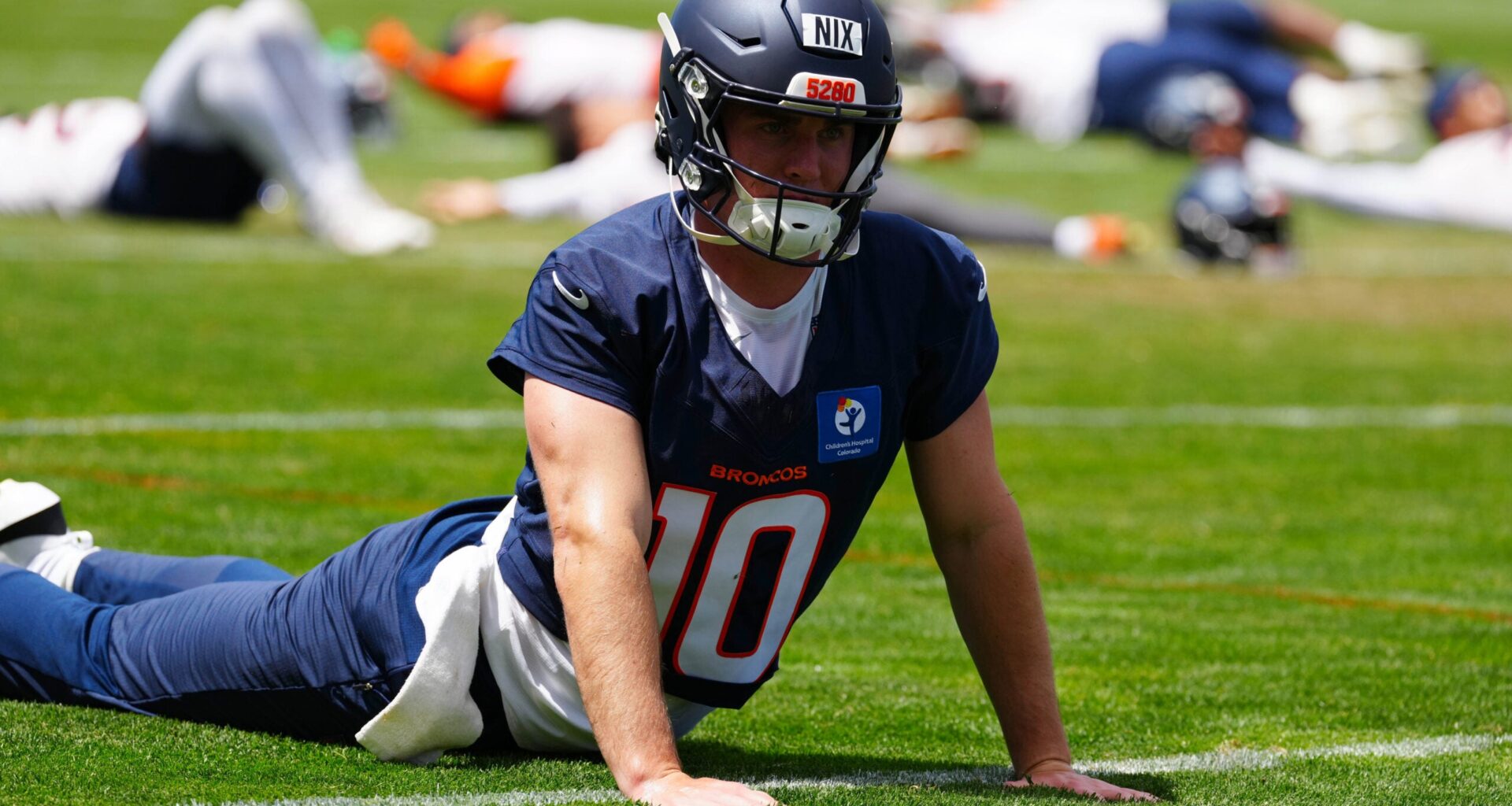 Jun 16, 2026; Englewood, CO, USA; Denver Broncos quarterback Bo Nix (10) warms up during mini camp at Broncos Park.