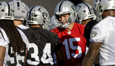 Raiders quarterback Fernando Mendoza (15) greets fullback Connor Heyward (34) during an NFL foo ...
