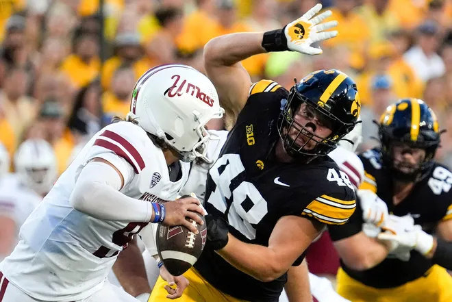 Iowa Hawkeyes defensive lineman Max Llewellyn (48) pressures Massachusetts Minutemen quarterback Grant Jordan (9) Sept. 13, 2025 at Kinnick Stadium in Iowa City, Iowa.