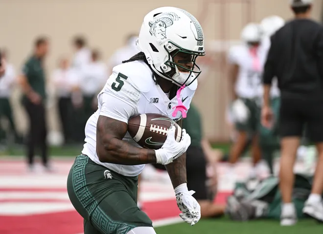 Oct 18, 2025; Bloomington, Indiana, USA; Michigan State Spartans running back Makhi Frazier (5) runs the ball prior to the game against the Indiana Hoosiers at Memorial Stadium. Mandatory Credit: Robert Goddin-Imagn Images