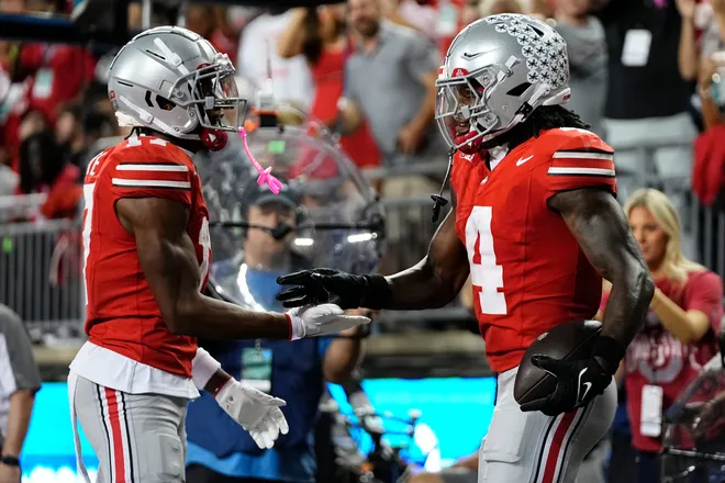 Ohio State Buckeyes wide receiver Carnell Tate (17) celebrates a touchdown by wide receiver Jeremiah Smith (4) during the first half of the NCAA football game against the Minnesota Golden Gophers at Ohio Stadium in Columbus on Oct. 4, 2025.