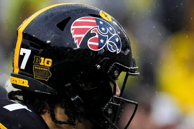 The Iowa Hawkeyes wore helmets featuring the American Flag over their usual logo Nov. 8, 2025 during a Big Ten Football game against the Oregon Ducks ahead of Veterans Day at Kinnick Stadium in Iowa City, Iowa.