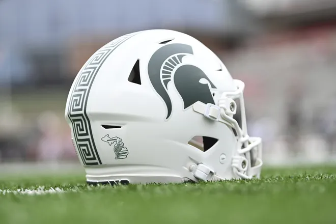 Sep 7, 2024; College Park, Maryland, USA; A detailed view of Michigan State Spartans helmet on the field before the game against the Maryland Terrapins at SECU Stadium. Mandatory Credit: Tommy Gilligan-Imagn Images