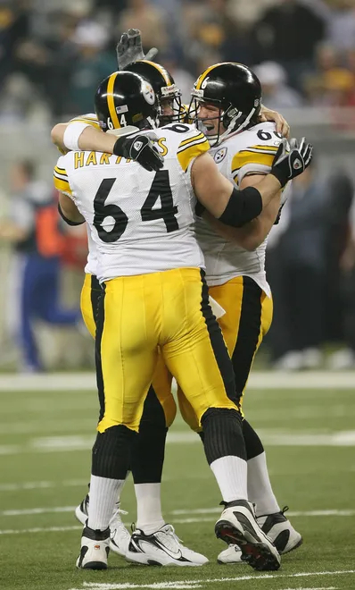 DETROIT - FEBRUARY 05:  Offensive linemen Jeff Hartings #64 and Alan Faneca #66 and quarterback Ben Roethlisberger #7 of the Pittsburgh Steelers celebrate after Willie Parker's 75-yard touchdown in the third quarter against the Seattle Seahawks in Super Bowl XL at Ford Field on February 5, 2006 in Detroit, Michigan.  (Photo by Harry How/Getty Images)