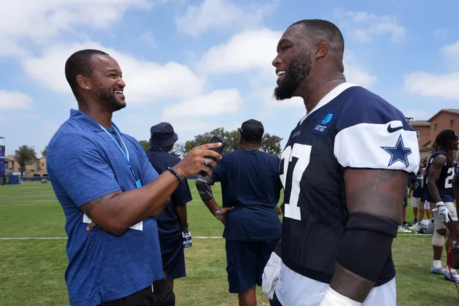 Jul 29, 2026; Oxnard, CA, USA; USA Today sports reporter Tyler Dragon (left) interviews Dallas Cowboys defensive tackle Kenny Clark (97) at training camp at River Ridge Playing Fields. Mandatory Credit: Kirby Lee-Imagn Images