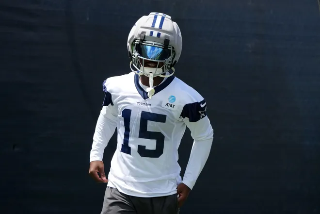 Jul 29, 2026; Oxnard, CA, USA; Dallas Cowboys receiver Tyler Johnson (15) wears a Guardian helmet cap at training camp at River Ridge Playing Fields. Mandatory Credit: Kirby Lee-Imagn Images