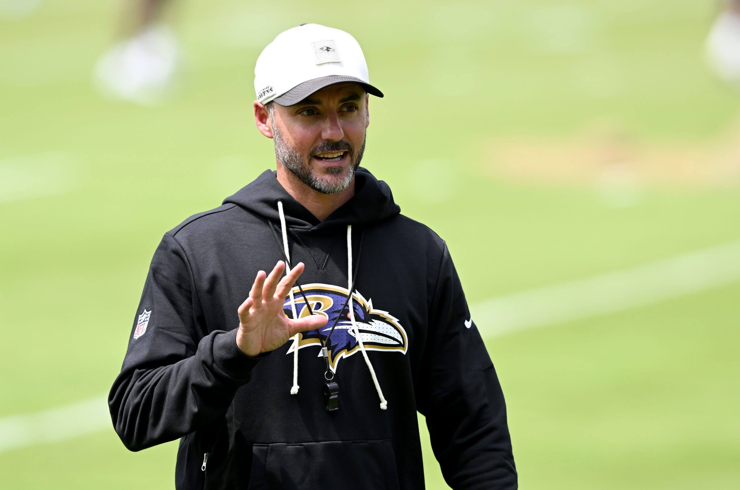 Head coach Jesse Minter of the Baltimore Ravens walks off the field after Baltimore Ravens Mandatory Minicamp