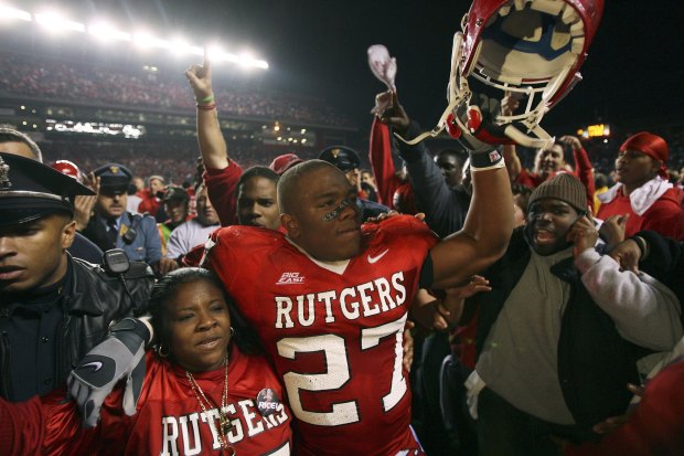 Ray Rice of the Rutgers University Scarlet Knights celebrates victory with his mom against the University of Louisville Cardinals on November 9, 2006 at Rutgers Stadium in Piscataway, New Jersey.