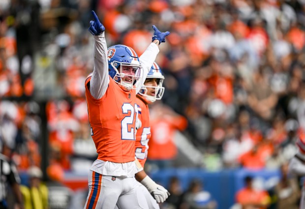 Riley Moss (21) of the Denver Broncos celebrates breaking up a pass intended for CeeDee Lamb (88) of the Dallas Cowboys during the first quarter at Empower Field at Mile High in Denver on Sunday, Oct. 26, 2025. (Photo by AAron Ontiveroz/The Denver Post)