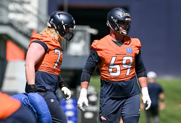 Frank Crum (73) and Mike McGlinchey (69) of the Denver Broncos work out with their group during OTAs at the Broncos Park in Centennial, Colorado on Thursday, June 4, 2026. (Photo by AAron Ontiveroz/The Denver Post)